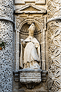 San Ambrosio de Milán, en la hornacina inferior izquierda entre las columnas de orden gigantes (Portada Principal de la Iglesia de San Miguel)