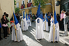 Nazarenos del cortejo del paso de Misterio de la Hermandad de Cristo Rey en su Triunfal Entrada en Jerusalén