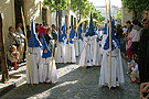 Nazarenos del cortejo del paso de Misterio de la Hermandad de Cristo Rey en su Triunfal Entrada en Jerusalén